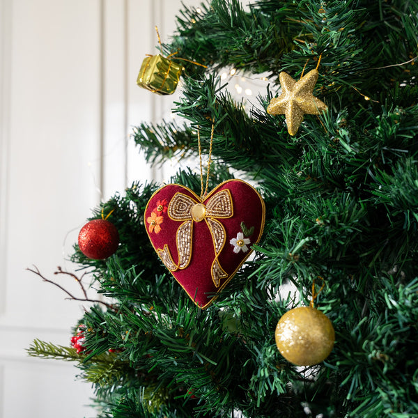 Decorative heart ornament with a bow on a Christmas tree! Luxury Hand-Embroidered Christmas Ornaments India
